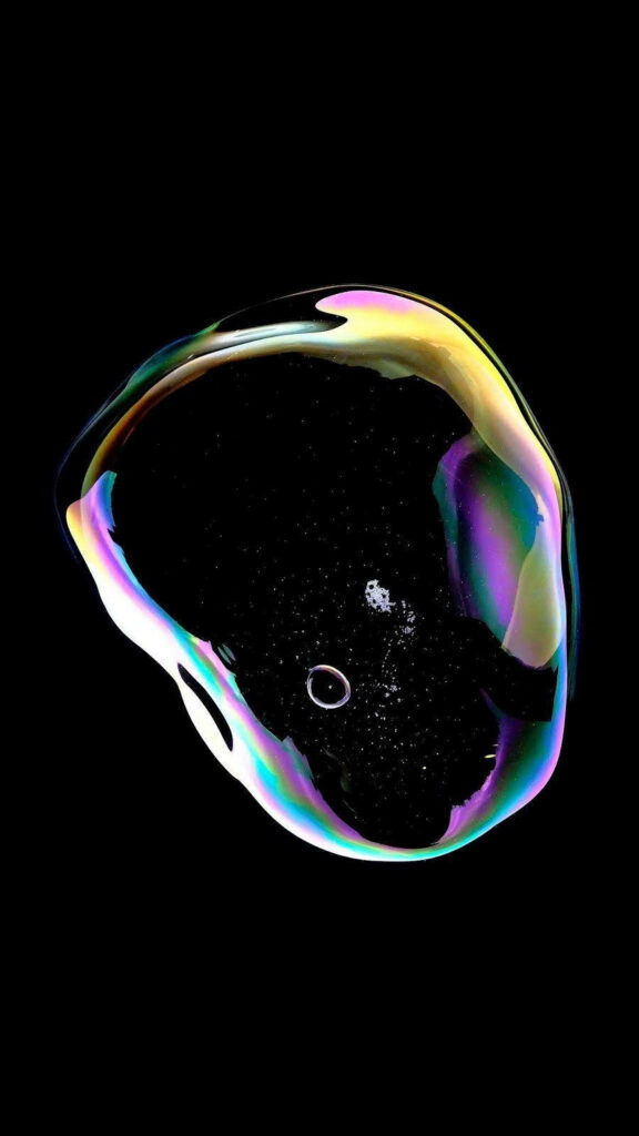 Iridescent rainbow soap bubble on deep black AMOLED background iconic iPhone X wallpaper