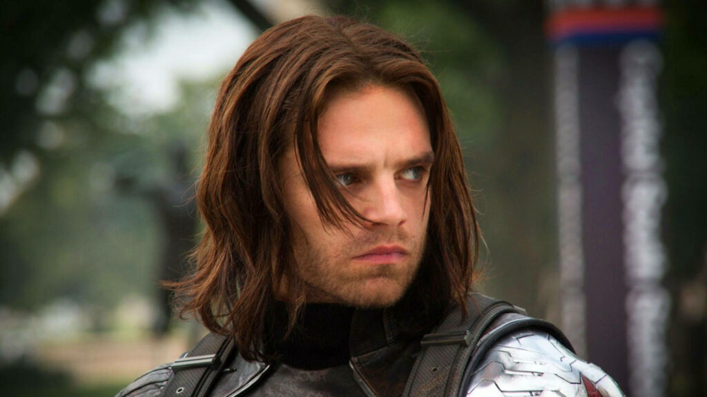 Bucky Barnes serious expression looking left long brown hair metal arm Marvel earthy wallpaper background