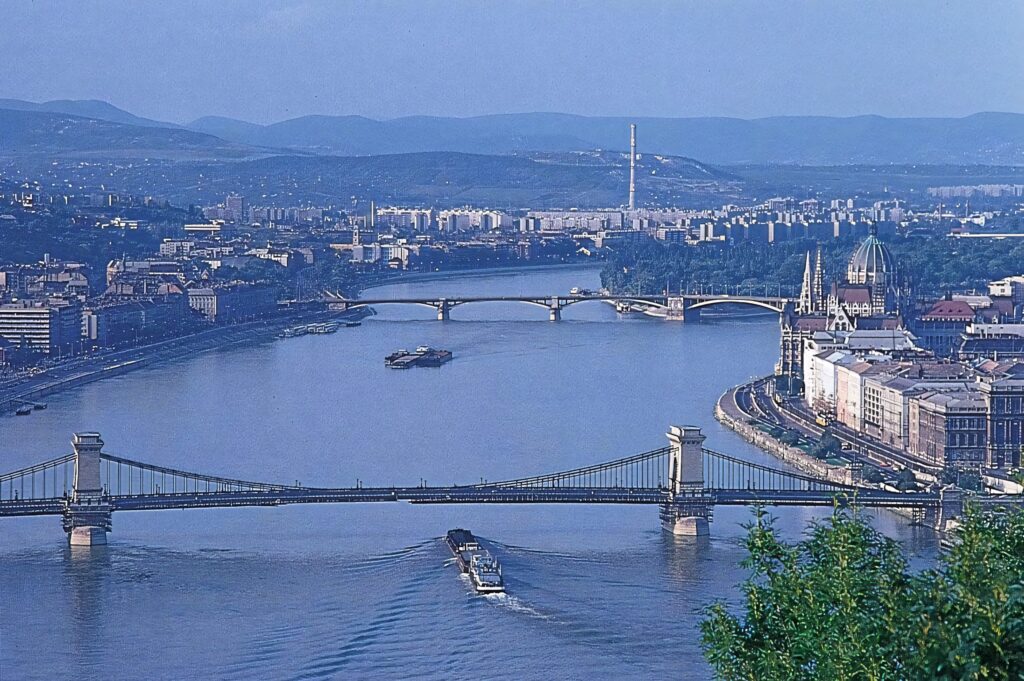 Scenic Budapest wallpaper with Danube River bridges and vibrant city riverside architecture view