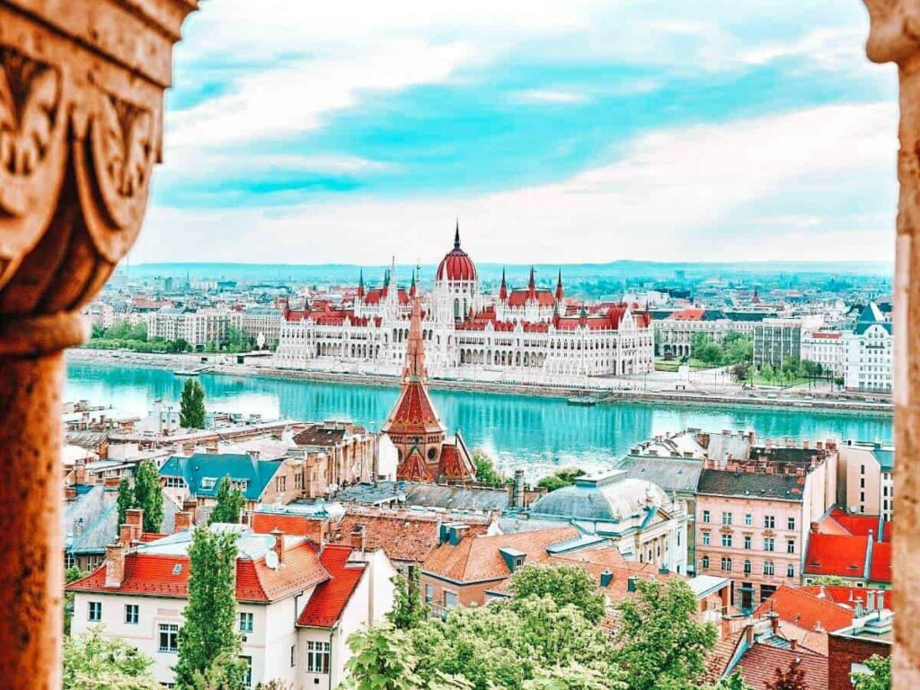 Stunning Budapest wallpaper with Hungarian Parliament and Danube River framed by stone archway