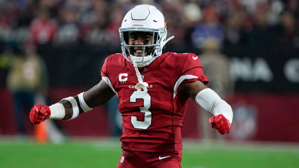 Budda Baker Arizona Cardinals celebrating in red white uniform dynamic intense football pose Wallpaper
