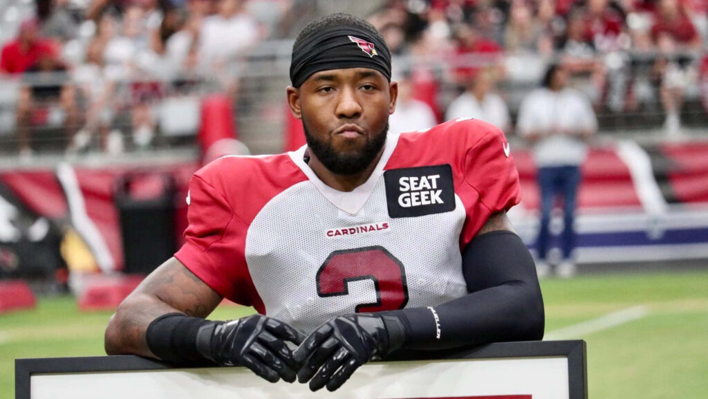 Budda Baker Arizona Cardinals football player in red white uniform on field stadium background Wallpaper