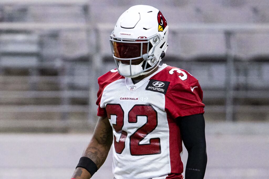 Budda Baker in Arizona Cardinals red white uniform number 32 intense game-ready stance wallpaper