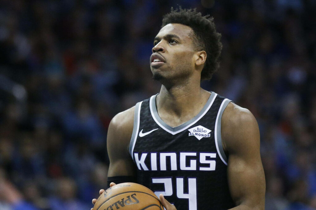 Buddy Hield Sacramento Kings focused free throw shot cool blue background basketball wallpaper