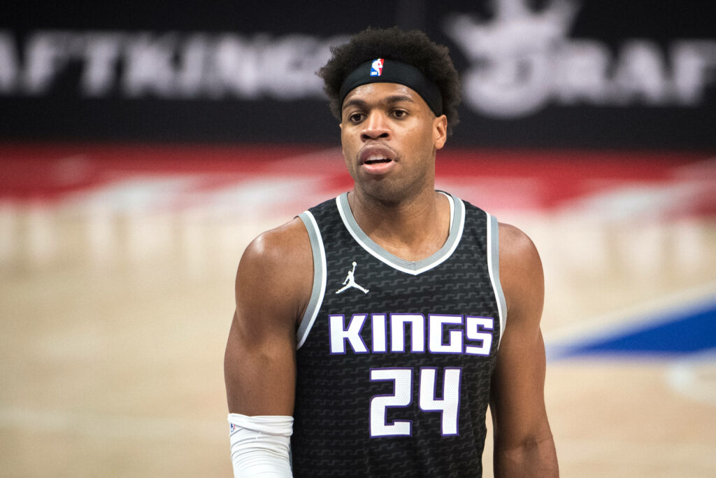 Buddy Hield focused on court in Sacramento Kings purple number 24 jersey vibrant high resolution image Wallpaper