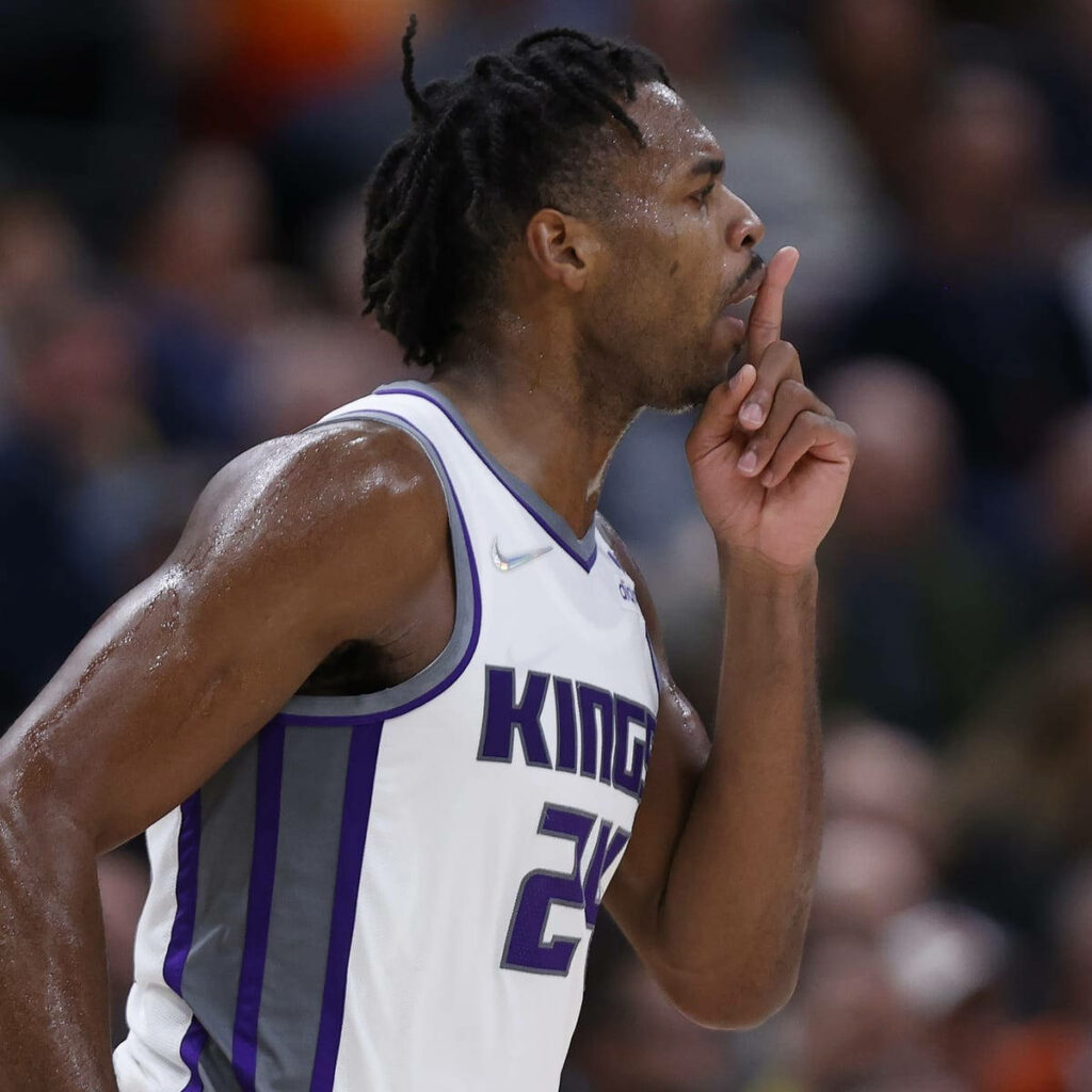 Buddy Hield Sacramento Kings silence gesture intense game action competitive basketball moment Wallpaper