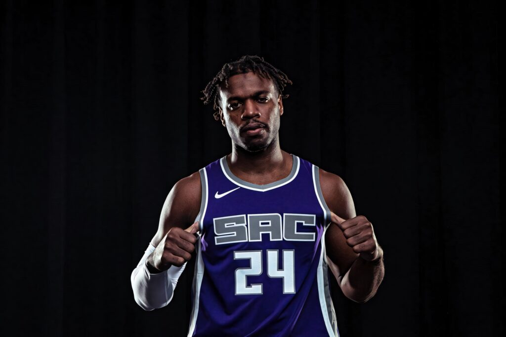 Portrait of Sacramento shooting guard Buddy Hield in purple jersey number 24 with focused expression Wallpaper