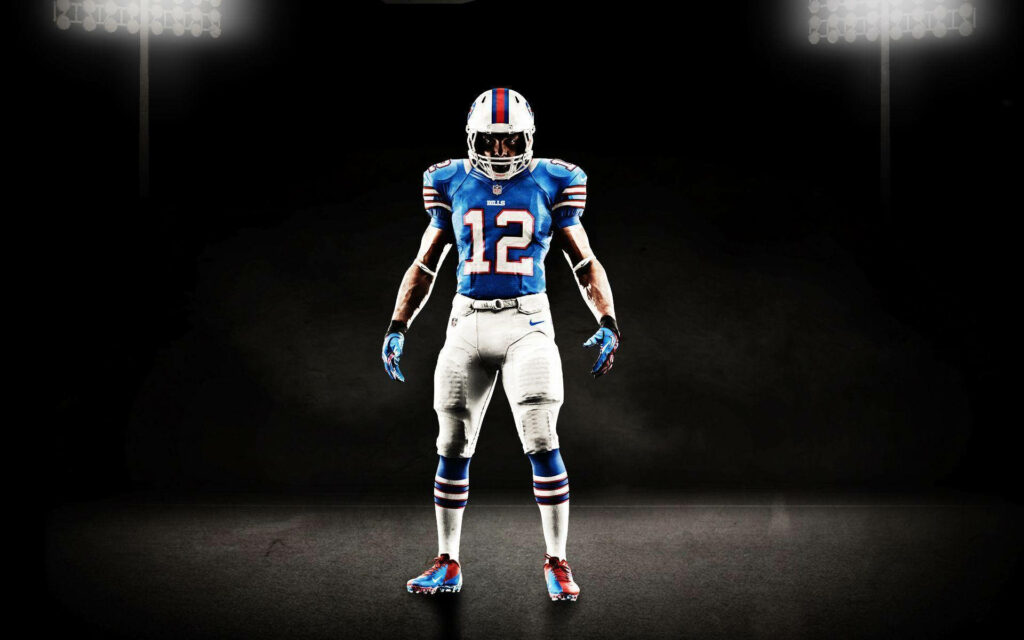 Buffalo Bills football player number 12 in powerful stance with vivid team colors stadium lights Wallpaper
