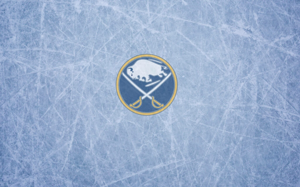 Buffalo Sabres logo on scratched gray ice background with crossed sabers in blue gold white Wallpaper