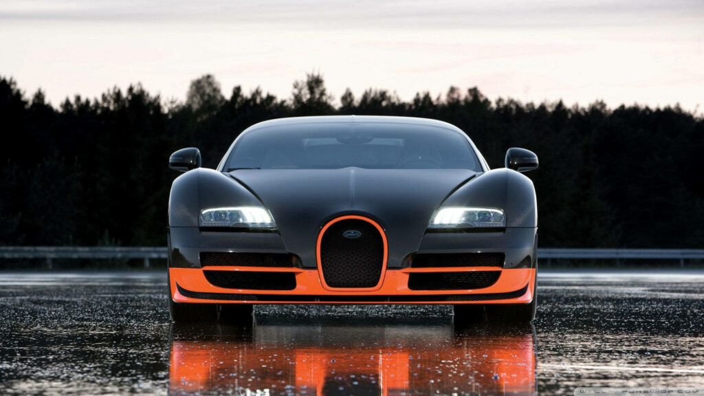 Symmetrical wallpaper of black orange Bugatti Veyron front view with glossy finish and LED headlights