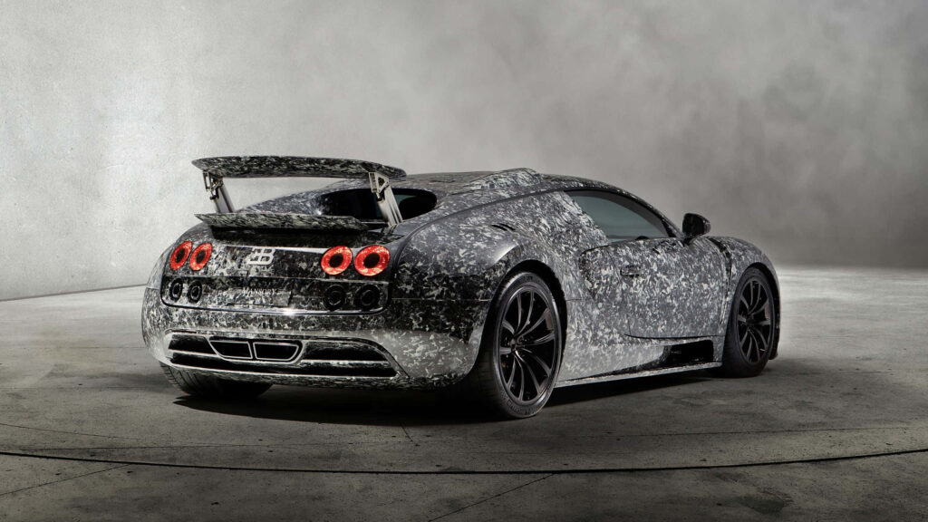 Bugatti Veyron S silver car with sleek curves aerodynamic design on concrete background wallpaper