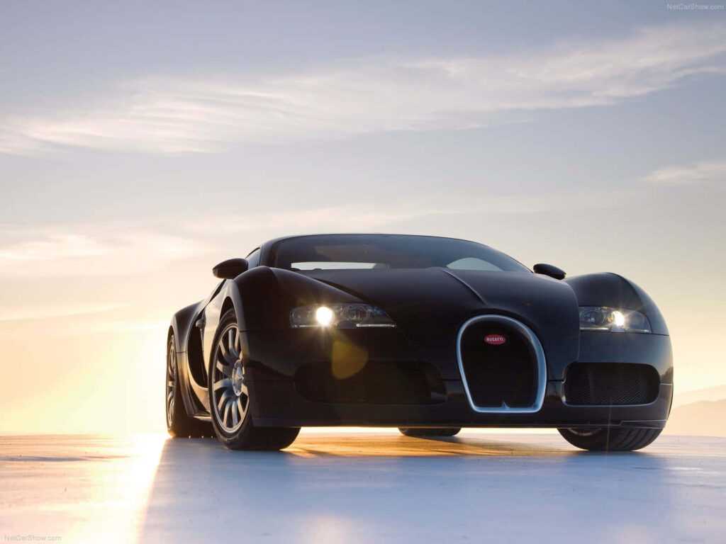 Bugatti Veyron supercar parked at sunset showcasing sleek design and powerful performance wallpaper