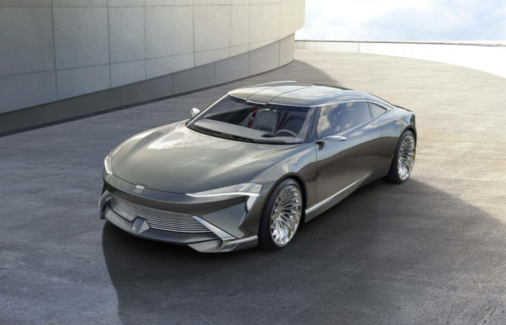 Buick Wildcat Concept Car with sleek lines metallic finish and modern architectural backdrop wallpaper