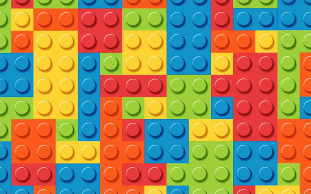 Vibrant 4K wallpaper featuring a colorful grid of classic plastic building bricks in red blue yellow green and orange