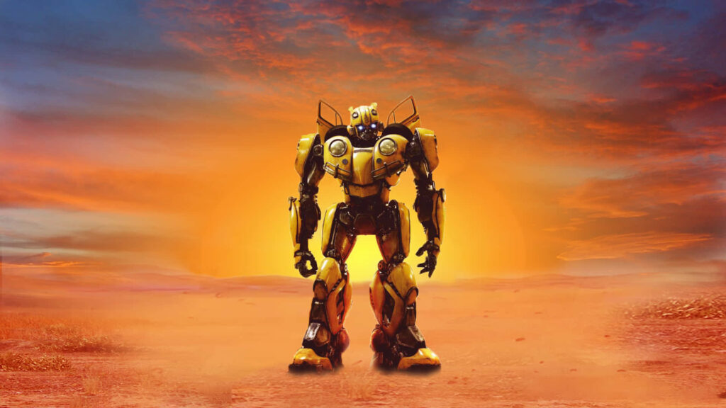 Bumblebee Transformer in yellow and black stands boldly at glowing sunset desert wallpaper background