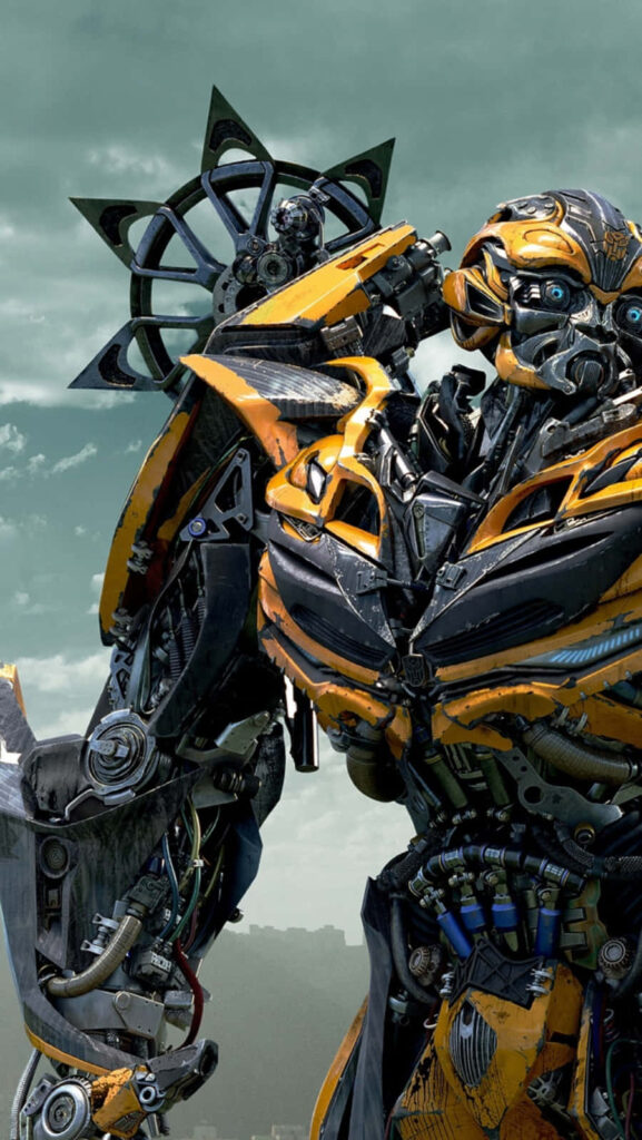 High-definition wallpaper of Transformers Bumblebee in bright yellow dynamic pose against clouds