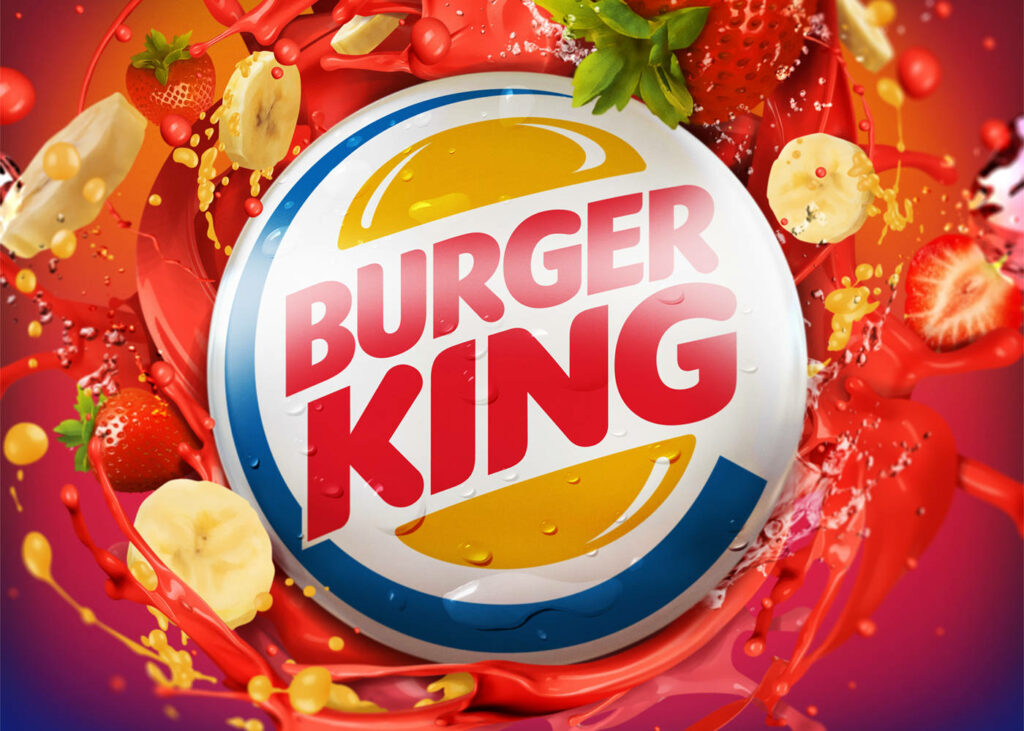 Burger King logo on vibrant red background with colorful fruit splashes for lively wallpaper