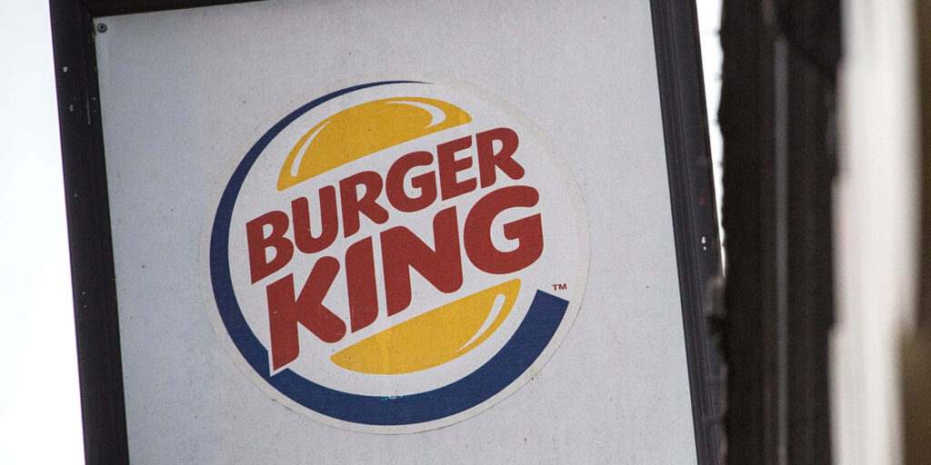 Burger King logo wallpaper with vibrant red yellow blue on white background iconic fast food design