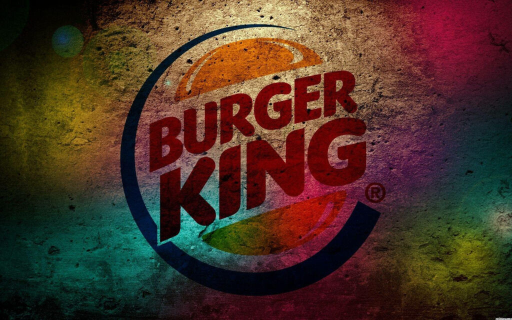 Burger King logo on grungy concrete background with vibrant red orange blue yellow splashes wallpaper
