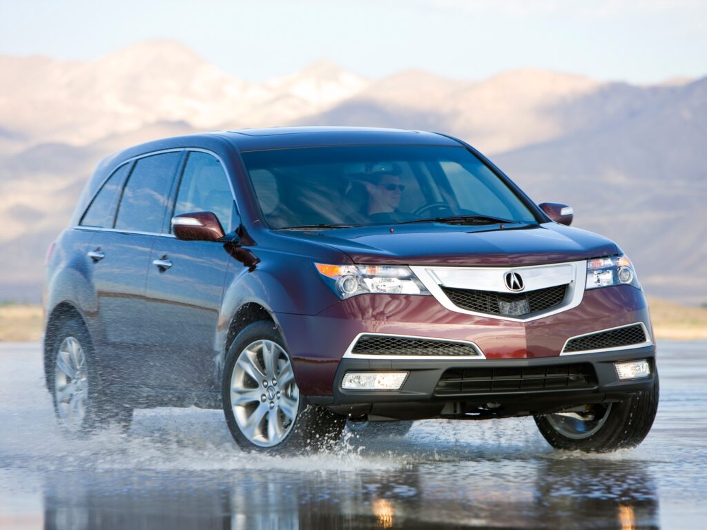 Burgundy Acura MDX Drifting on Wet Asphalt: Dynamic Mountain View Wallpaper