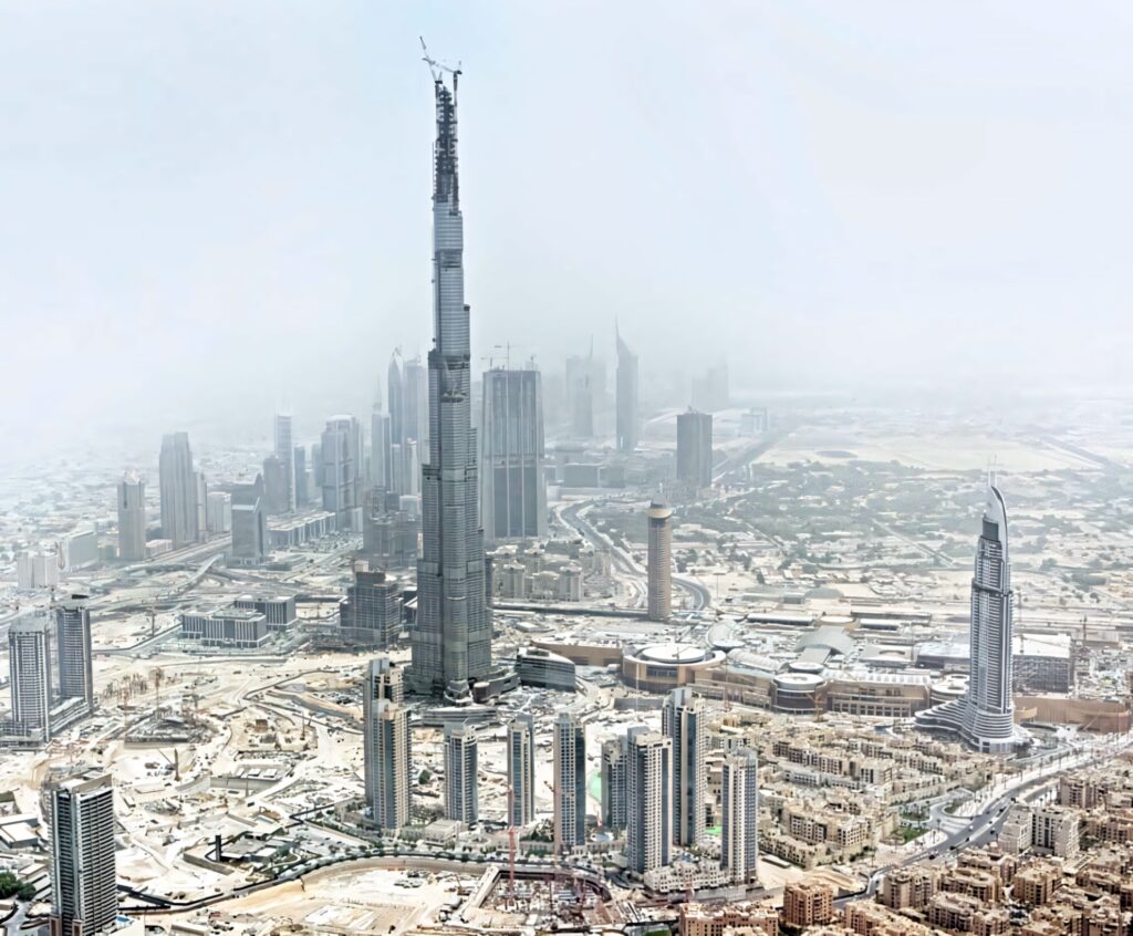 Burj Khalifa towering over Dubai skyline at dusk modern architecture evening cityscape wallpaper