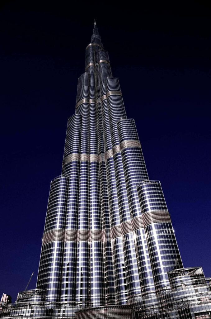 Burj Khalifa illuminated at night showcasing modern architecture and shimmering glass facade wallpaper