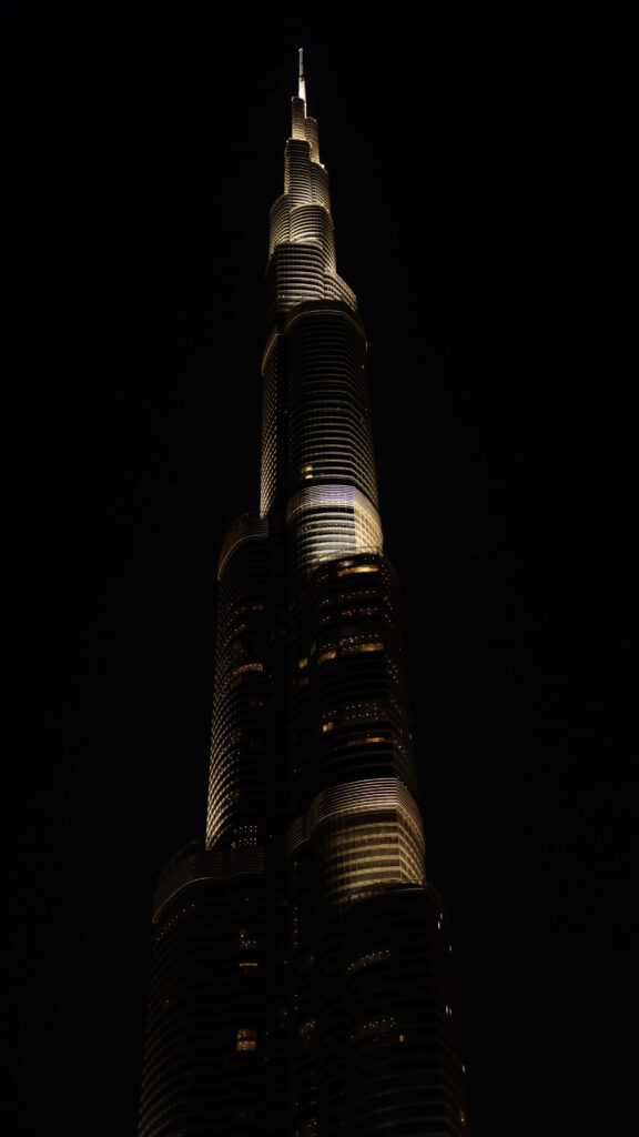 Burj Khalifa illuminated at night phone wallpaper sleek glass facade modern minimalist design
