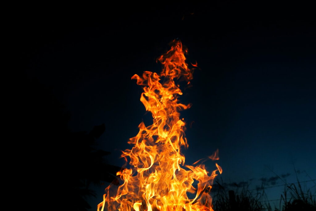 HD fire wallpaper vibrant orange yellow flames burning bright against dark night sky background