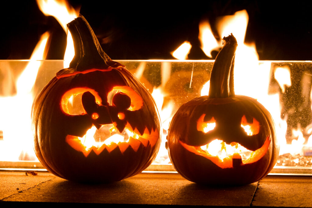 Horrifying Halloween: Fiery Jack-o'-Lanterns Illuminate a Sinister Night Wallpaper