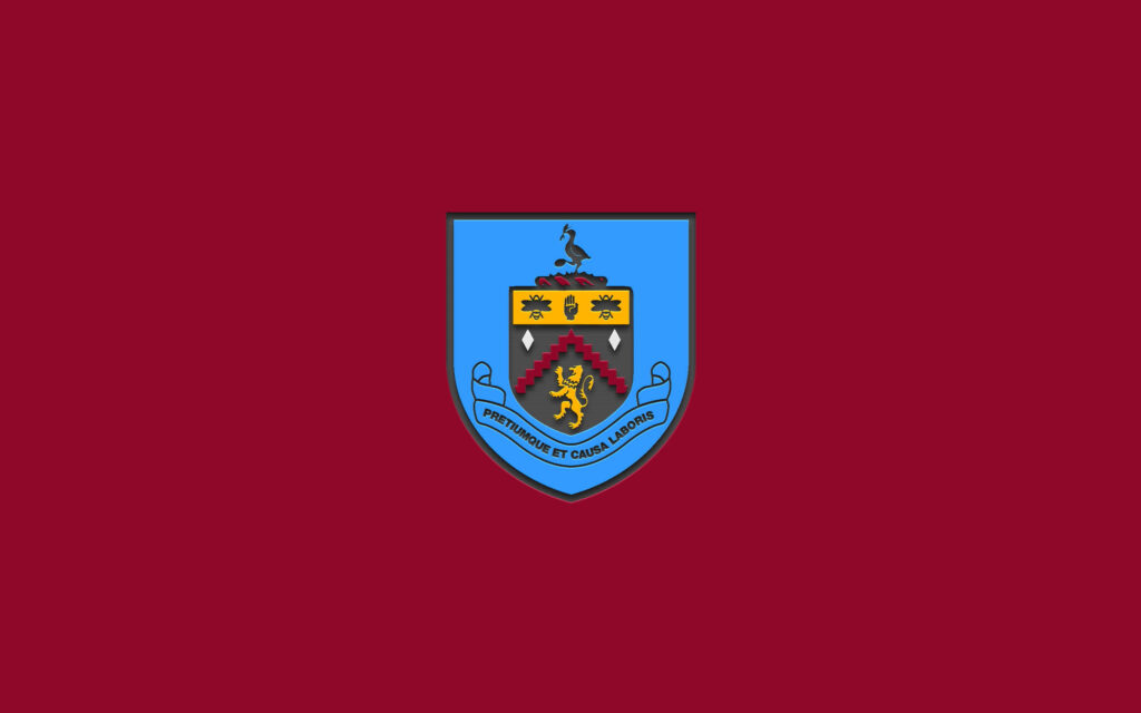 Burnley FC wallpaper with detailed club crest on claret background featuring team motto