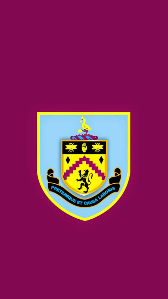 Burnley FC wallpaper with detailed yellow and blue crest on claret background showcasing club motto
