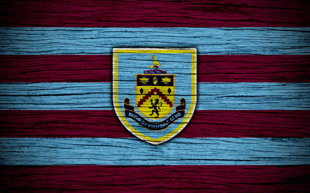 Burnley FC crest on claret and blue striped textured wood background vintage wallpaper