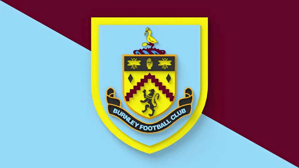 Burnley FC wallpaper with detailed club crest centered on maroon and sky blue background