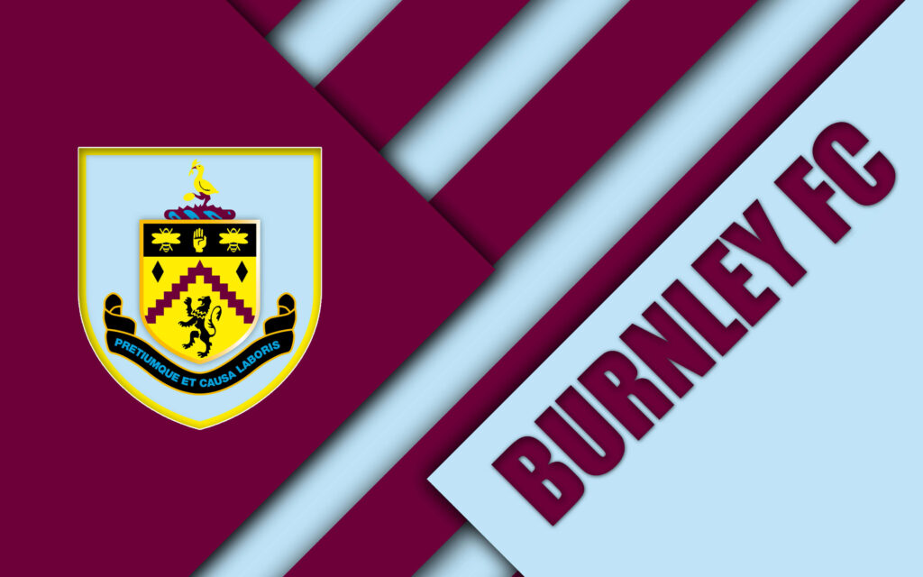 Burnley FC crest on claret and sky blue diagonal background with bold modern sporty text Wallpaper