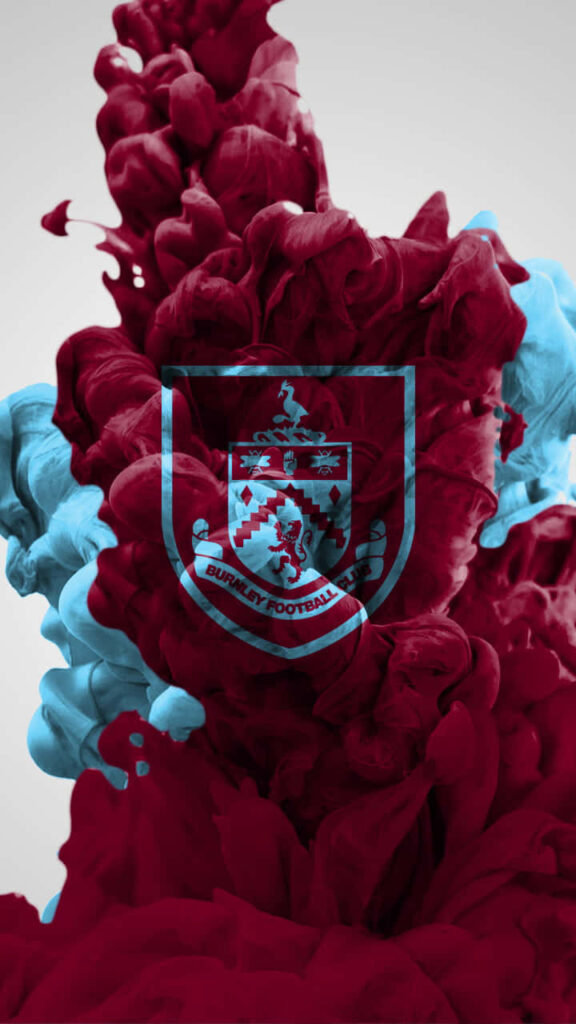 Burnley FC wallpaper with club crest over abstract claret and blue clouds on neutral background