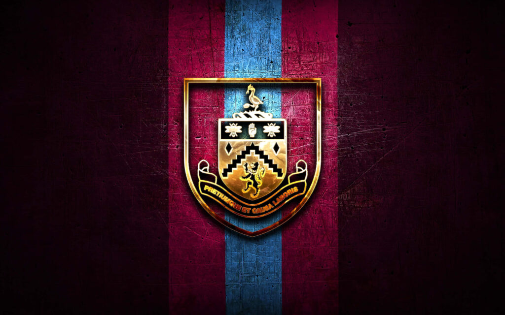 Burnley FC wallpaper with gold-accented crest on claret and blue striped textured background