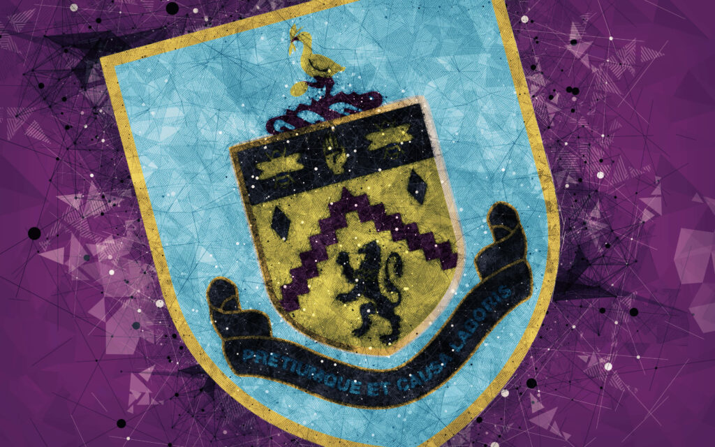 Burnley FC crest on vibrant purple abstract background with geometric patterns and black accents Wallpaper