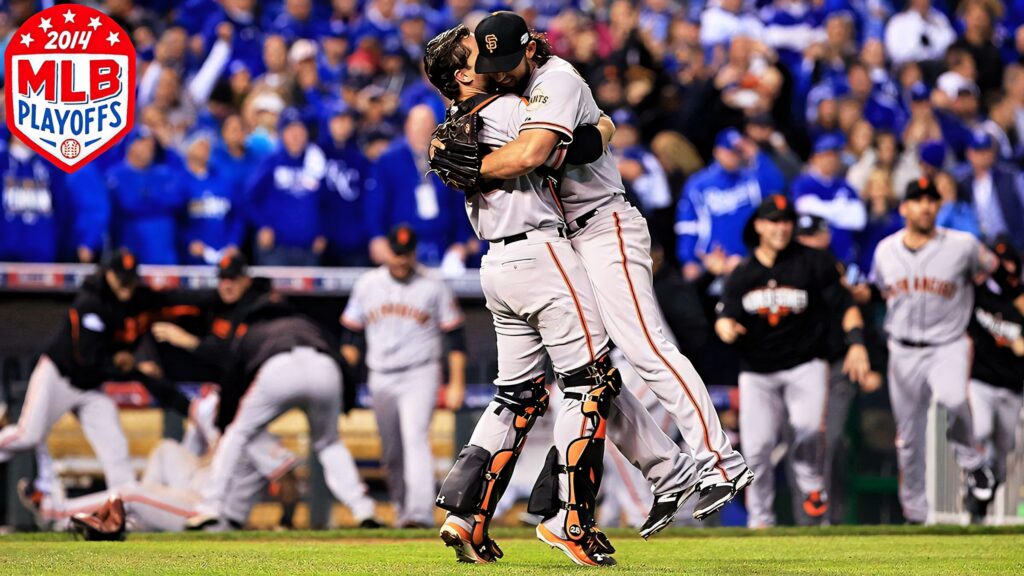 Buster Posey celebrates victory with teammate during 2014 MLB Playoffs vibrant Giants fans background Wallpaper