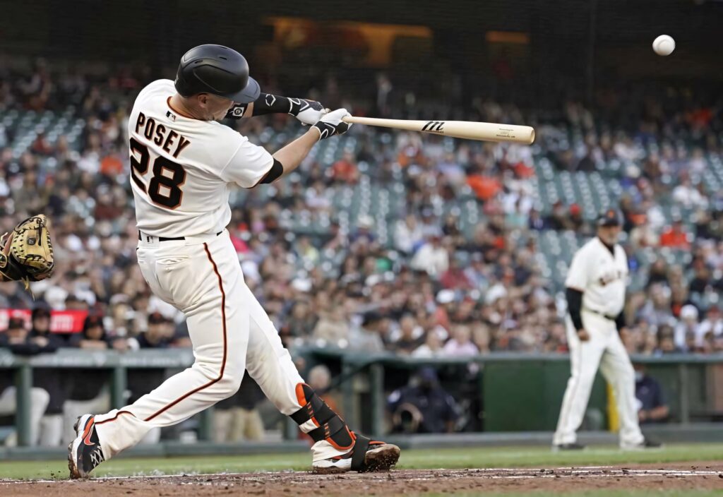 Buster Posey hitting a home run in San Francisco Giants uniform with energetic stadium crowd Wallpaper