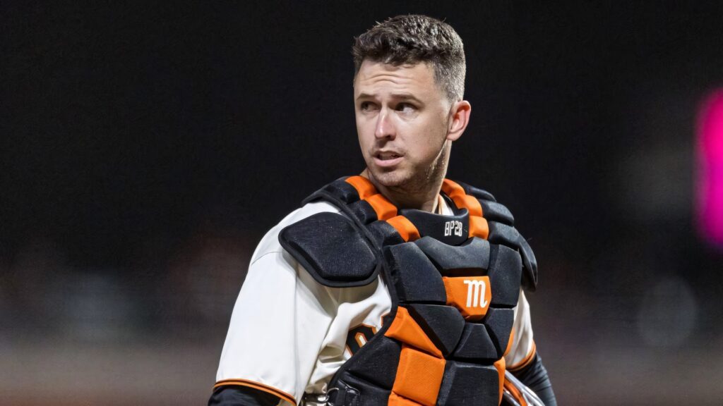 Buster Posey in San Francisco Giants catcher gear black orange chest protector intense portrait Wallpaper