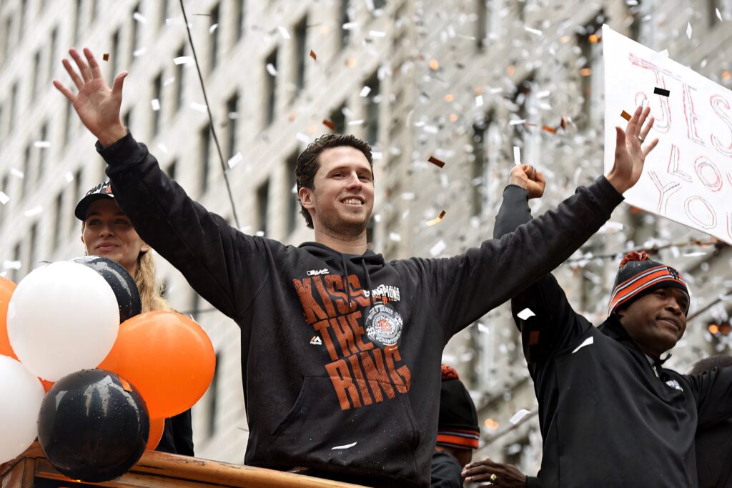 Buster Posey celebrates World Series victory on float with confetti balloons and cheering fans Wallpaper
