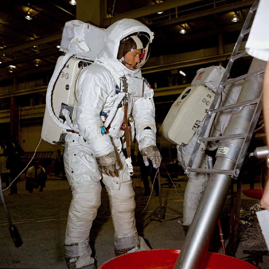 Buzz Aldrin in Apollo spacesuit with life support backpack during detailed mission test setup Wallpaper