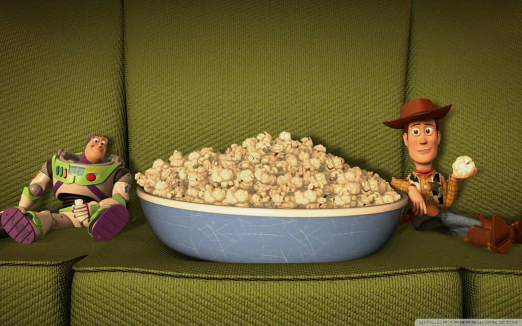 Toy Story Duo: Woody and Buzz Chow Down on Popcorn in Epic Wallpaper