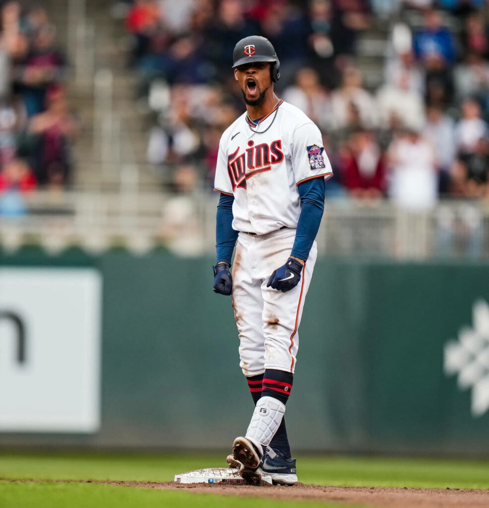 Byron Buxton shouting on field in Minnesota Twins uniform vibrant baseball action wallpaper