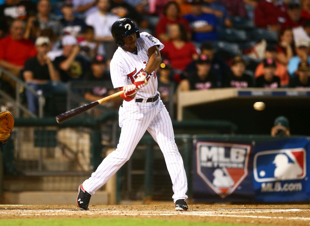 Byron Buxton mid-swing baseball wallpaper vibrant stadium background showcasing athletic power