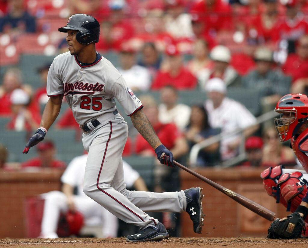 Byron Buxton Minnesota Twins swinging bat mid-action focused intense baseball moment wallpaper