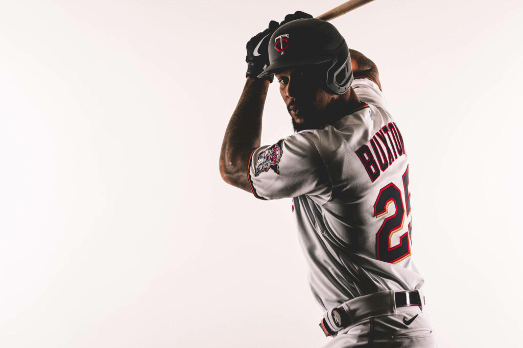 Byron Buxton in Minnesota Twins uniform in dynamic batting stance with sharp colors and focus Wallpaper