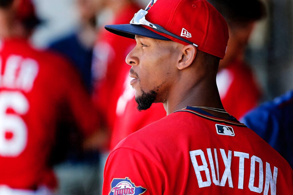 Byron Buxton Minnesota Twins side profile wallpaper vibrant reds blues baseball game energy