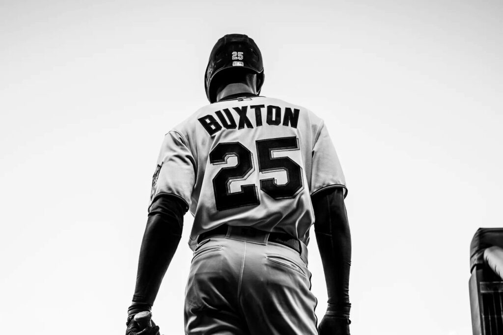 Byron Buxton in black and white wearing number 25 jersey with dramatic lighting wallpaper