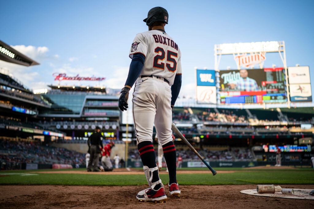 Byron Buxton ready to bat at Target Field with stadium lights and crowd in the background wallpaper